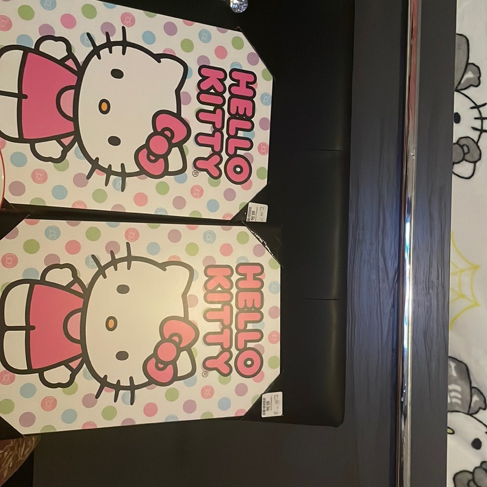 Two hello kitty wall decorations